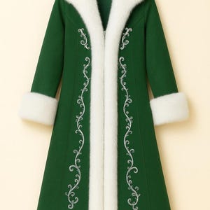 May include: A long, forest green coat featuring a thick white faux fur collar and cuffs. The front of the coat is decorated with intricate silver embroidery in a scrolling vine pattern that runs vertically along the opening of the garment.