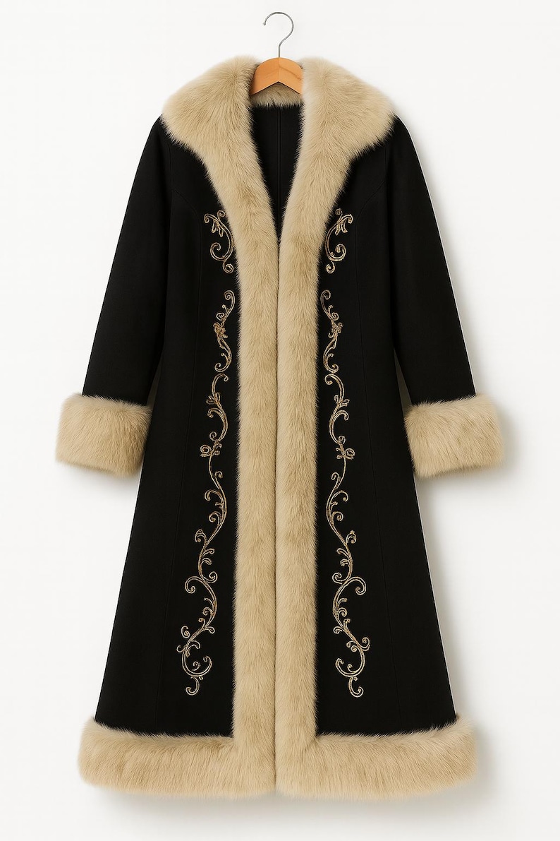 May include: A long black coat featuring a beige faux fur collar, cuffs, and hem trim. The front of the coat is decorated with gold-colored embroidery in a scrolling vine pattern that runs vertically along both sides of the opening.