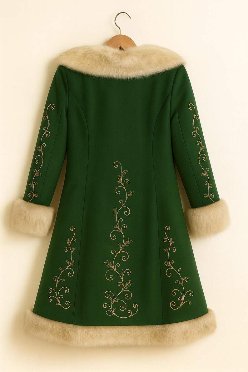 May include: A forest green coat featuring long sleeves, a beige faux fur collar, beige faux fur sleeve cuffs, and a beige faux fur hem. The coat is decorated with gold-colored embroidered scrollwork patterns along the sleeves and the back.