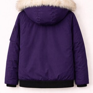 May include: A purple bomber jacket with a hood and a faux fur trim. The jacket has a black ribbed hem and cuffs. A small pocket with a zipper is on the left sleeve. The jacket is hanging on a wooden hanger.