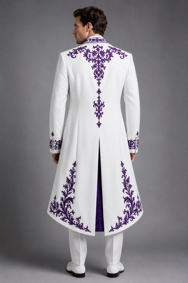 May include: A long white coat featuring intricate purple embroidery along the collar, back, and hemline. The garment has long sleeves with purple embroidered cuffs, a high collar, and a center back vent revealing a deep purple inner lining.