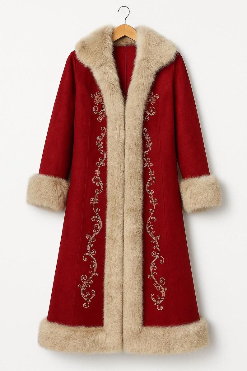 May include: A long, deep red coat featuring a thick, beige faux fur trim along the collar, front opening, cuffs, and hem. The coat is decorated with intricate, symmetrical gold-colored embroidery patterns running vertically along the front panels.