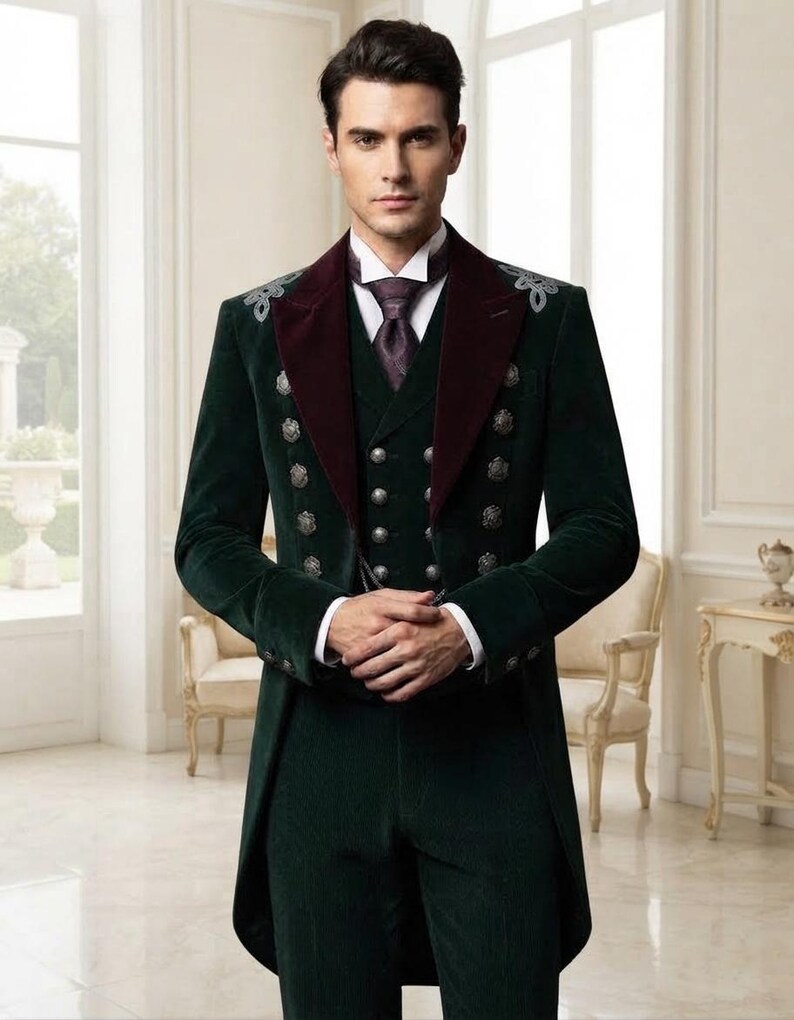 May include: A dark green velvet tailcoat suit featuring a deep burgundy velvet lapel, silver decorative buttons, and silver embroidery on the shoulders. The ensemble includes a matching vest, a white collared shirt, and a patterned dark purple necktie.