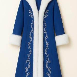 May include: A long, royal blue coat featuring a thick white faux fur trim along the front opening, collar, sleeve cuffs, and hem. The coat is decorated with intricate silver embroidery in a scrolling vine pattern along the front panels.
