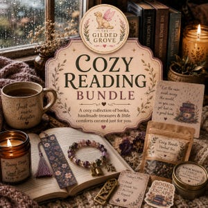 May include: A cozy reading bundle featuring a beige sign with the text The Gilded Grove Cozy Reading Bundle, a ceramic mug with the text Just one more chapter, a beaded bracelet, a floral bookmark, a tea pouch, a candle, and a small note card.