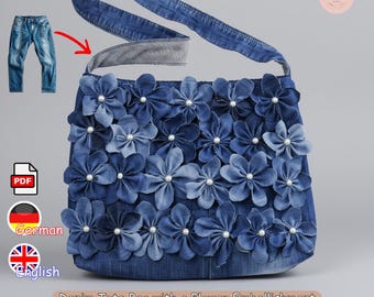 May include: A denim tote bag with a flower embellishment. The bag is adorned with numerous blue denim flowers, each centered with a pearl. The bag has a denim strap and is displayed with a pair of jeans.