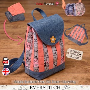 May include: A backpack constructed from blue denim and quilted fabric featuring a repeating cat pattern in grey and pink. The bag has a denim flap with a yellow flower-shaped button, denim straps, and a tag reading "UPCYCLED FOR BACK TO SCHOOL".