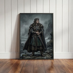 May include: A framed wall art print depicting a figure wearing a dark fur-trimmed cloak, a crown, and layered garments, standing on a rocky cliffside by a stormy sea. The figure holds a sword with both hands, featuring muted tones of gray, green, and brown.