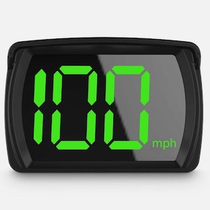 May include: A black digital speedometer display featuring a rectangular housing with a dark screen. The screen shows the bright green digital number 100 with the text mph in a smaller green font positioned in the lower right corner of the display.