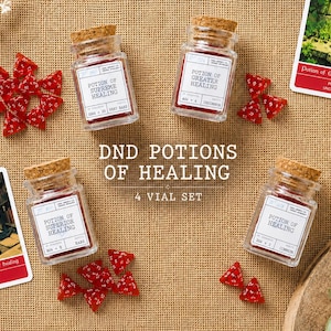 May include: Four glass vials with cork stoppers containing red liquid, each with a white label reading Potion of Supreme Healing, Greater Healing, Superior Healing, or Healing. Includes red polyhedral dice and two illustrated game cards.