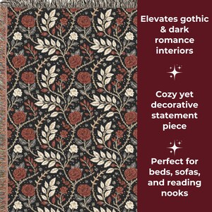 May include: A black throw blanket with a repeating pattern of red roses, white flowers, and green leaves. The blanket has a fringed edge and is suitable for beds, sofas, and reading nooks.