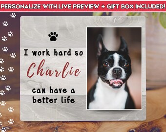 May include: Wooden pet photo frame with a picture of a black and white dog. The frame has the text "I work hard so Charlie can have a better life" and paw prints.