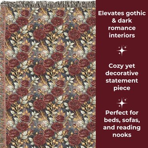 May include: A woven throw blanket with a repeating pattern of burgundy roses, gold accents, and white leaves on a dark gray background. The blanket has a fringed edge and text that reads "Elevates gothic & dark romance interiors."