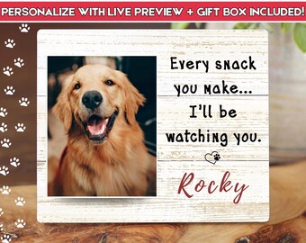 May include: A wooden picture frame with a photo of a Golden Retriever dog. The frame has the text "Every snack you make... I'll be watching you. Rocky."
