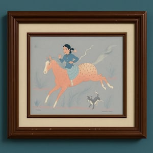 May include: Framed artwork featuring a girl riding a pink horse with brown spots, a small dog, and a light blue background. The girl wears a blue top and skirt. The artwork is in a brown wooden frame.