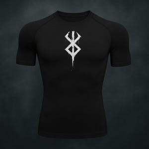 May include: Black short-sleeved compression top featuring a white graphic symbol on the chest. The symbol has a vertical line extending downwards. The top has a crew neck and raglan sleeves.