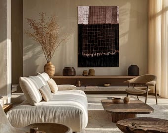 May include: A modern living room with neutral tones. A large abstract artwork with a grid pattern hangs above a wooden shelf. A beige sofa with striped cushions, a wooden coffee table, and a chair complete the space. Decorative vases and dried plants add to the aesthetic.