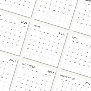 May include: A collection of white paper calendar pages for the year 2027, featuring black text for the months of June, July, October, and November. Each page displays a grid layout with days of the week and numerical dates in a clean, minimalist style.