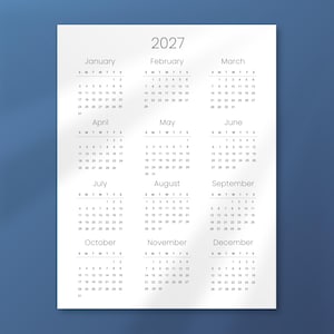 May include: A white 2027 calendar with a simple design. Each month is displayed with its days and dates, starting with January and ending with December. The calendar is on a blue background.