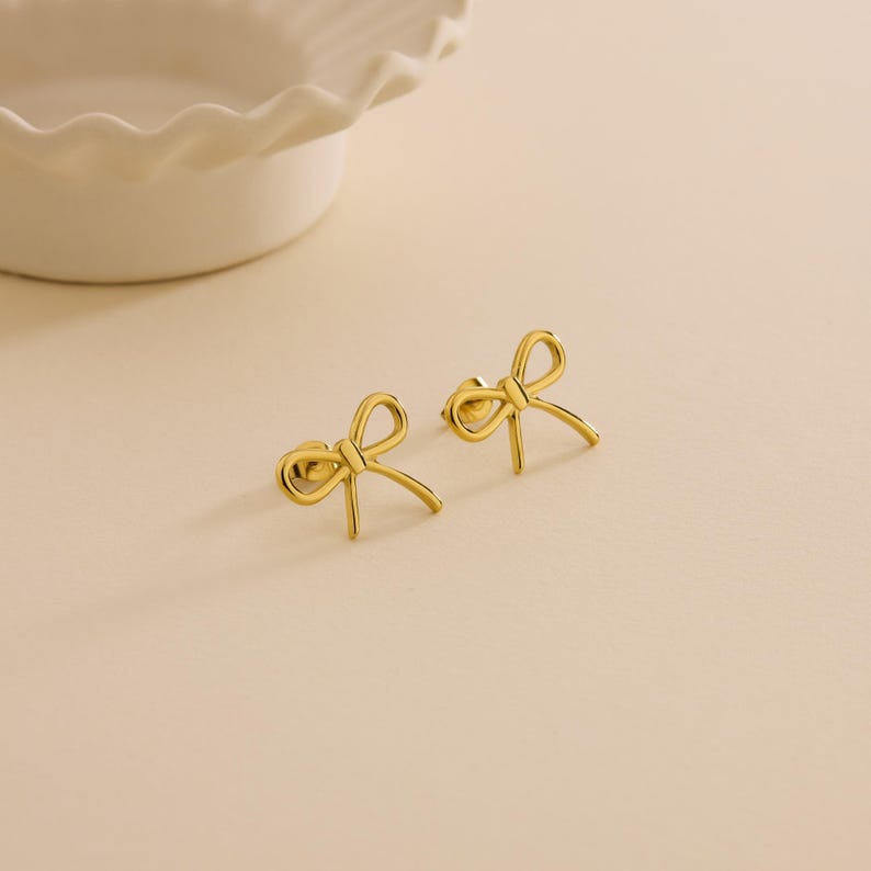 gold plated dainty bow earrings stainless steel hypoallergenic elegant and timeless design