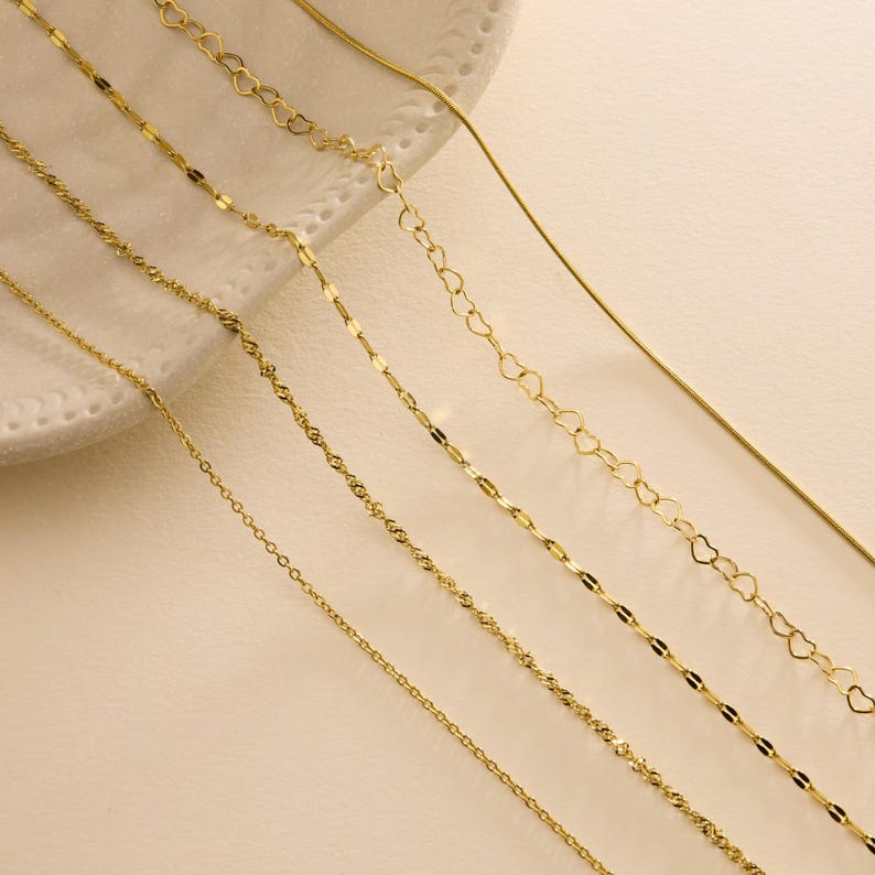 Elegant cable, snake, twist, heart, and sequin chains in silver finish everyday wear perfect for any outfit or occasion.