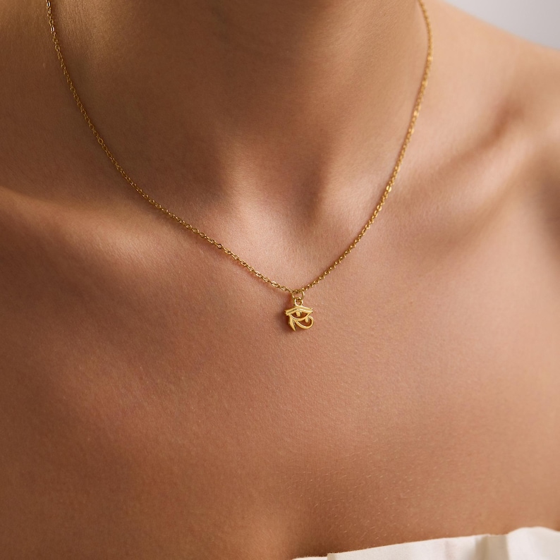 A detailed Eye of Horus pendant crafted from gold plated stainless steel, durable, tarnish free, and hypoallergenic for daily use.