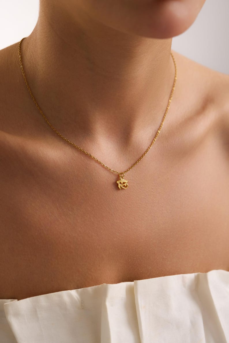Meaningful gold Eye of Horus necklace presented in a gift box, perfect for Christmas, birthdays, or spiritual celebration gifts.