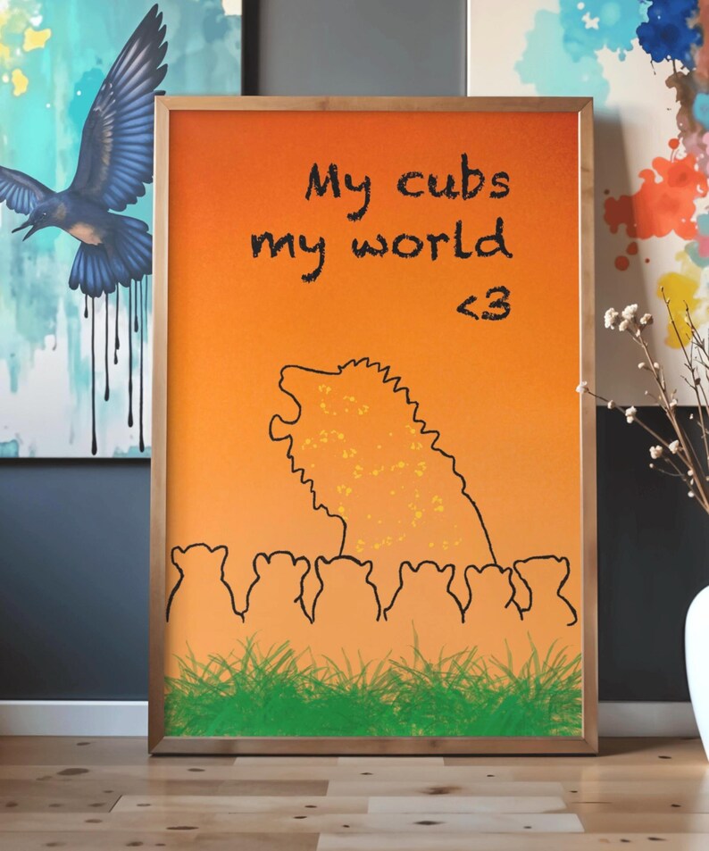May include: Framed art print with an orange and yellow gradient background. The artwork features a lion silhouette with the text "My cubs my world <3". Below the lion are several cub silhouettes and green grass.