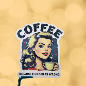 May include: A die-cut sticker featuring a retro-style illustration of a person with blonde hair holding a coffee cup. The text COFFEE is arched at the top, and BECAUSE MURDER IS WRONG is printed at the bottom. The sticker has a holographic finish.
