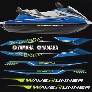 May include: A blue and white Yamaha WaveRunner personal watercraft shown above a set of matching adhesive decals. The decal set includes text reading Yamaha, Cruiser VX, and High Output 1.0 in blue, white, and lime green on a black background.