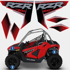 May include: Red Polaris RZR 200 off-road vehicle with black wheels and a silver roll cage. The vehicle has black and grey decals with the RZR logo and the number 200. Additional red and black decals are also included.