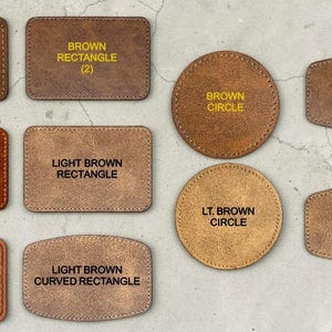 May include: A collection of ten leather patches in various shapes and shades of brown. The shapes include rectangles, circles, and hexagons. Each patch features yellow text identifying its specific shape and color, such as brown rectangle, chestnut rectangle, light brown circle, and khaki rectangle with black stitches.