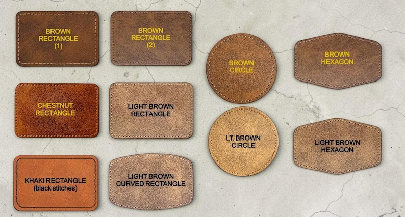 May include: A collection of ten leather patches in various shapes and shades of brown. The shapes include rectangles, circles, and hexagons. Each patch features yellow text identifying its specific shape and color, such as brown rectangle, chestnut rectangle, light brown circle, and khaki rectangle with black stitches.
