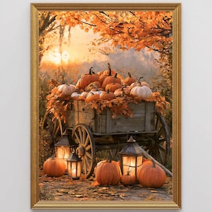 May include: A framed wall art print depicting a wooden wagon overflowing with orange pumpkins and autumn leaves. The scene is set in a forest at sunset with glowing lanterns on the ground, surrounded by additional pumpkins on the forest floor.