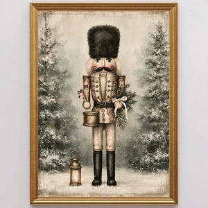 May include: A framed wall art print depicting a nutcracker soldier wearing a tall black fur hat, a tan uniform with gold buttons, and black boots. The figure holds a drum and a pine branch, standing in a snowy forest with a lit lantern nearby.