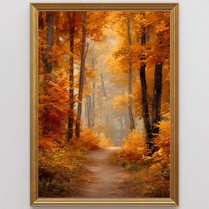 Könnte beinhalten: Gerahmtes Landschaftsgemälde einer herbstlichen Waldszene. Das Kunstwerk zeigt einen Weg, der sich durch Bäume mit leuchtend orangefarbenem und gelbem Laub schlängelt. Der Rahmen ist goldfarben.