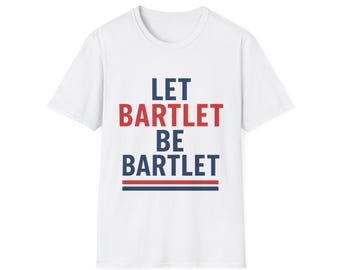 May include: White t-shirt with the text "LET BARTLET BE BARTLET" in red and blue block letters. The text is centered on the front of the shirt, with a red and blue horizontal line beneath the last word.