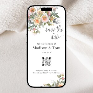 May include: A save the date card with a floral design. The card is in the shape of a smartphone screen and says "save the date" for the wedding of Madison & Tom on 12.23.20XX. A QR code is included with the text "Help Us Stay in Touch Scan & Update Your Address".
