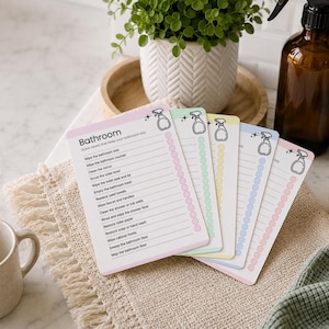 Bundle of printable cleaning cards featuring room-by-room cleaning checklists for bathrooms, kitchens, bedrooms, living rooms, and more. Editable Canva cleaning cards help organize household chores, create simple cleaning routines, and support ADHD-friendly home organization. Instant download with reusable and customizable cleaning checklists.