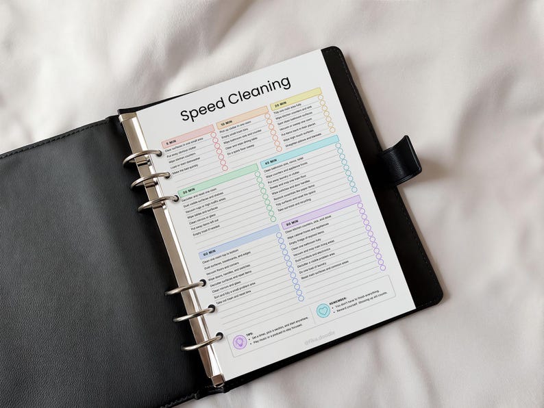 ADHD speed cleaning checklist printable PDF displayed inside a binder planner featuring 5, 10, 20, 30, 45, 60, and 90 minute cleaning sprint routines designed to reduce overwhelm and simplify household cleaning tasks. Includes ADHD-friendly cleaning schedules, low-energy cleaning systems, timed cleaning checklists, and printable home organization pages editable in Canva for digital or print use.