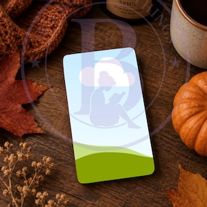 May include: A rectangular card with an illustration of a person reading under a cloud. The card has a blue sky and green grass design. The words "AI generated" are at the bottom of the card.