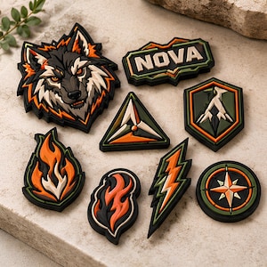 May include: A collection of eight tactical morale patches featuring a wolf head, the text NOVA, a triangle, a shield with a mountain, two flame shapes, a lightning bolt, and a compass, all rendered in black, orange, olive green, and cream colors.