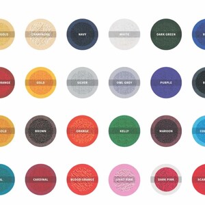 May include: A collection of 24 color swatches arranged in a grid. Each swatch is a circle with a textured appearance and a color name printed above it. Colors include Vegas Gold, Navy, White, Dark Green, and Scarlet Red.