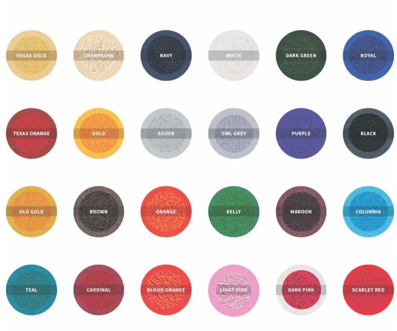 May include: A collection of 24 color swatches arranged in a grid. Each swatch is a circle with a textured appearance and a color name printed above it. Colors include Vegas Gold, Navy, White, Dark Green, and Scarlet Red.