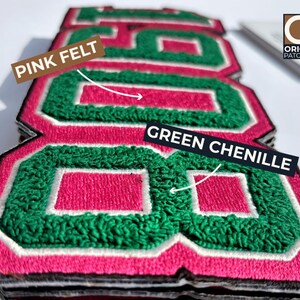 May include: Close-up of stacked, embroidered patches with the number "88". The patches feature pink felt, green chenille, and white and black borders. The Origin Patches logo is visible in the upper right corner.