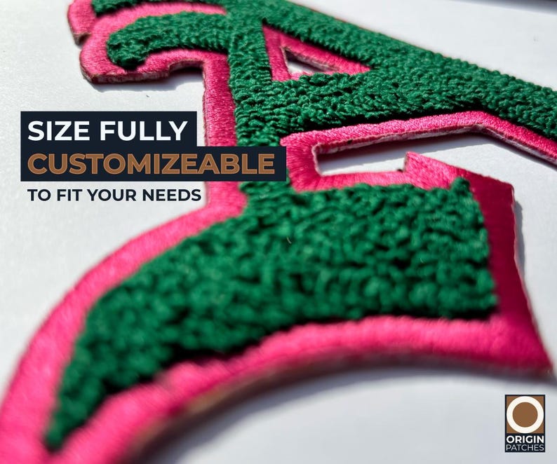 May include: Close-up of a custom patch with a green, textured letter "A" outlined in pink. The text "SIZE FULLY CUSTOMIZABLE TO FIT YOUR NEEDS" is displayed in a black and brown box. The Origin Patches logo is in the bottom right corner.