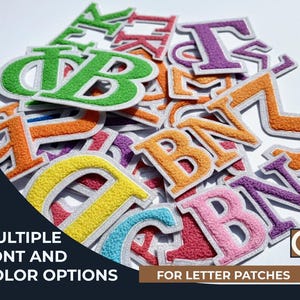 May include: A collection of colorful, embroidered letter patches in various fonts and colors. The patches feature a white border and are in shades of green, orange, yellow, pink, and purple. Text on the image reads "MULTIPLE FONT AND COLOR OPTIONS FOR LETTER PATCHES."