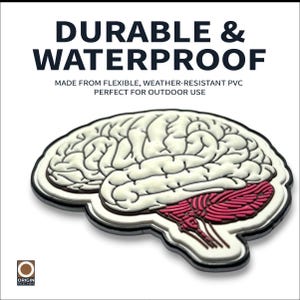 May include: A white and red brain-shaped patch with the text "DURABLE & WATERPROOF". The patch is made from flexible, weather-resistant PVC. The patch has a white background and a black border.