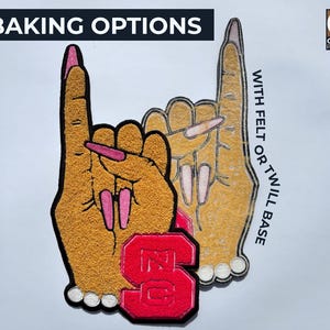 May include: Embroidered patch featuring two hands in a gesture, with long pink fingernails. The patch includes the text "BAKING OPTIONS" and "WITH FELT OR TWILL BASE". A red "NC" logo is also present.
