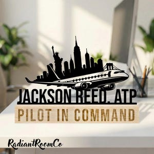 May include: A set of three ceramic mugs with a speckled, matte finish. The mugs are in shades of cream, light gray, and dark gray. Each mug has a simple, minimalist design and a rounded handle.